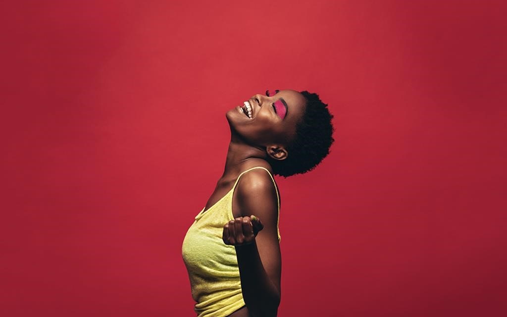 A women enjoying the mood in the red background