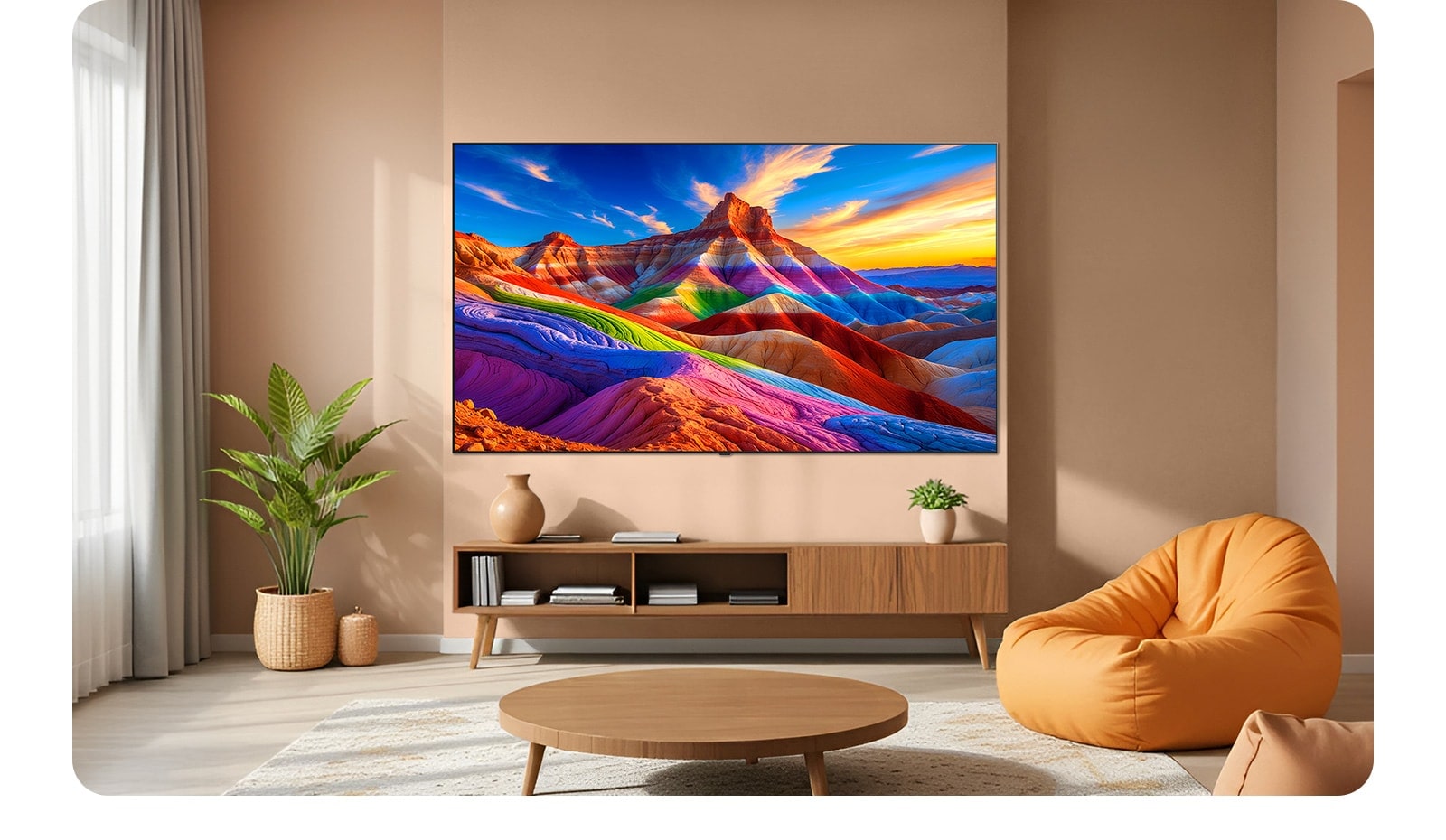 LG OLED AI B6 is wall-mounted in a styled living space, featuring an ultra-slim design with narrow bezels, and it displays a rainbow-toned landscape with layered mountain forms on screen.