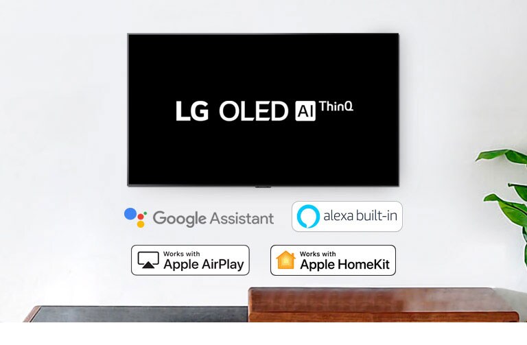 Монтиран на стената телевизор показва логото на LG OLED AI ThinQ на черен фон