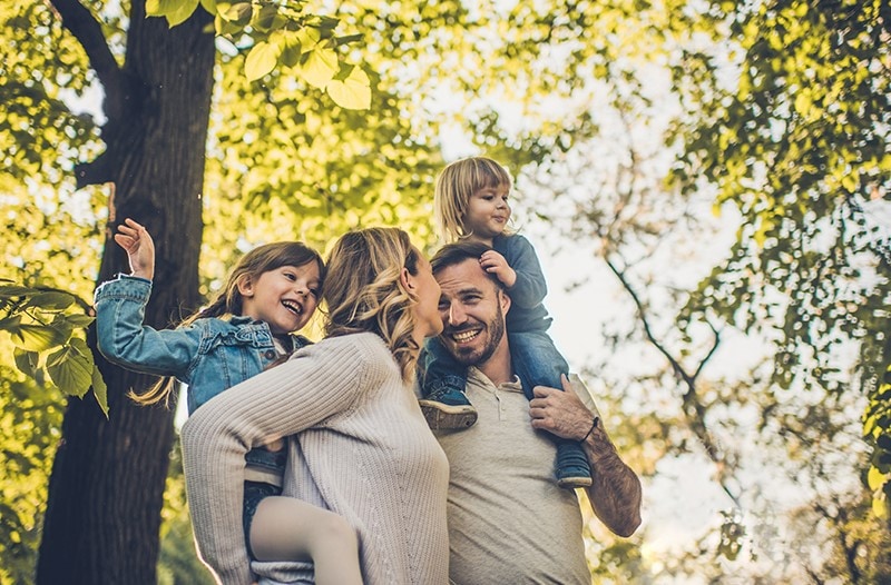A family enjoys the stunning forest in the sun - that's our hope for the future as we work towards a more sustainable world
