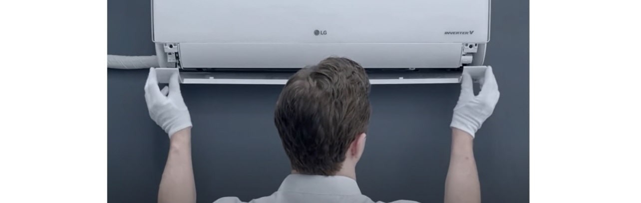 A technician repairing an airconditioner.