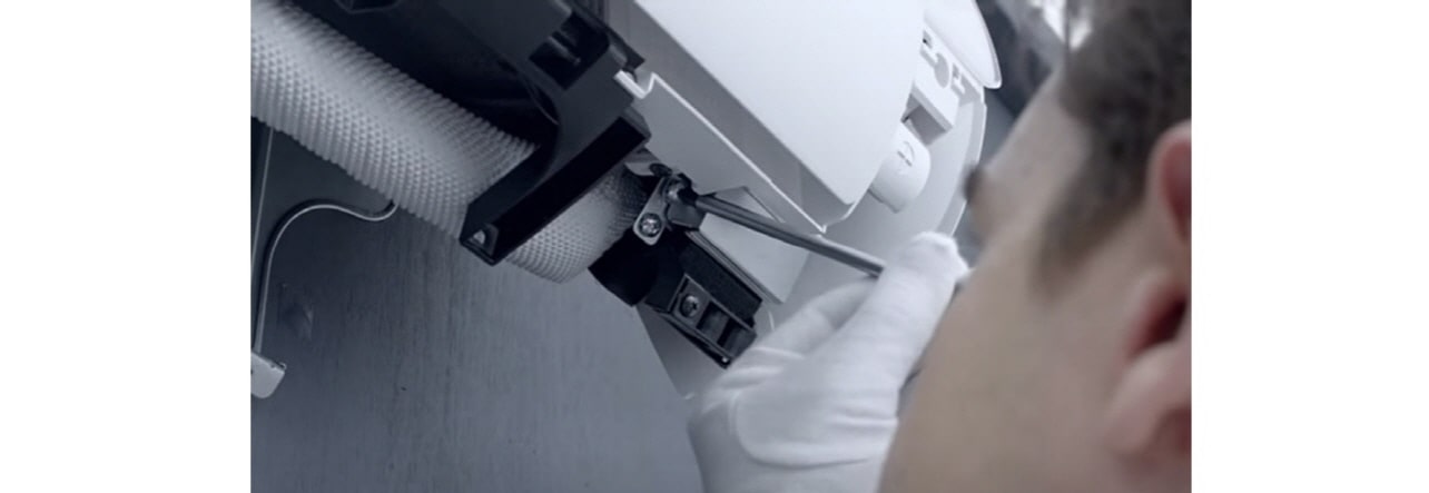 A technician repairing an airconditioner.