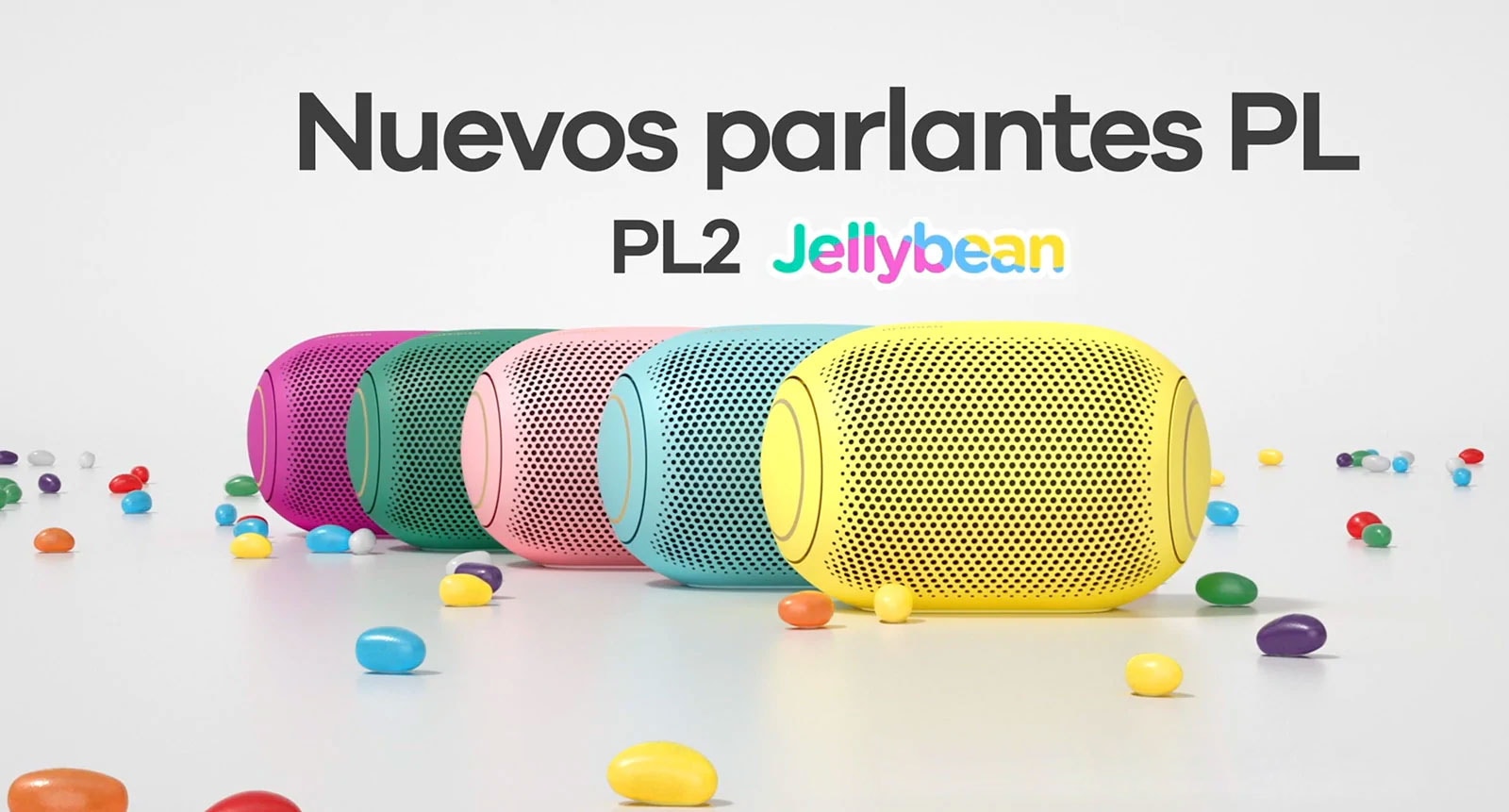 A front view of five colored jelly beans lined up behind each other.