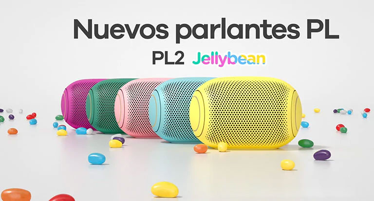 A front view of five colored jelly beans lined up behind each other.