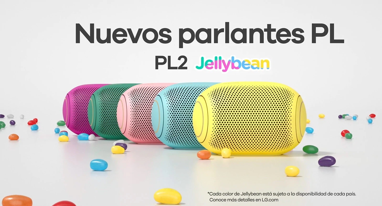 A front view of five colored jelly beans lined up behind each other.