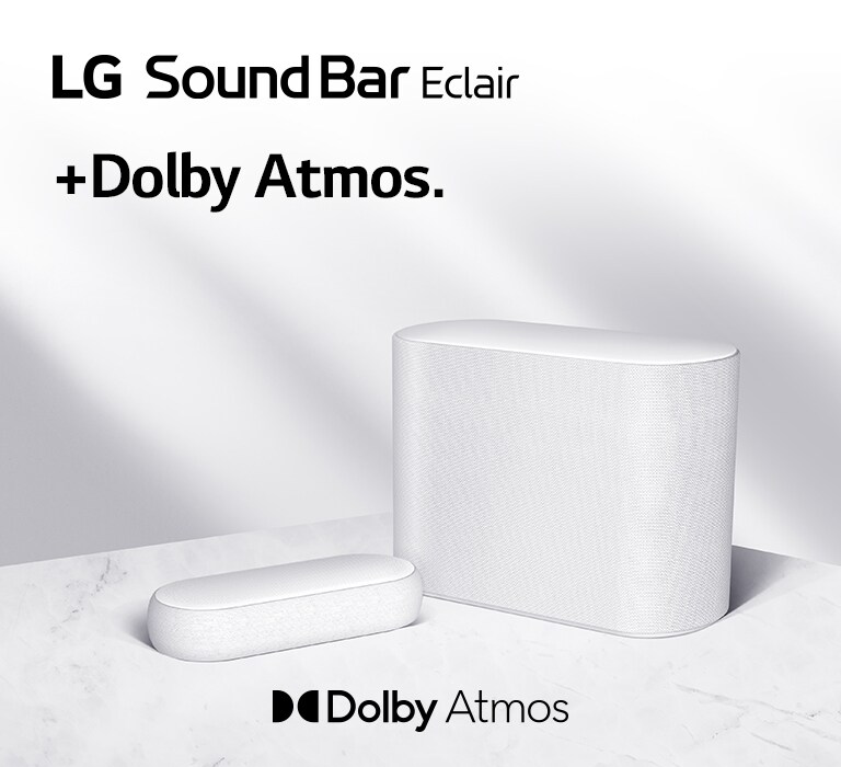 Una barra de sonido y un subwoofer se colocan en un piso de mármol, una barra de sonido y un subwoofer orientados hacia lados opuestos.