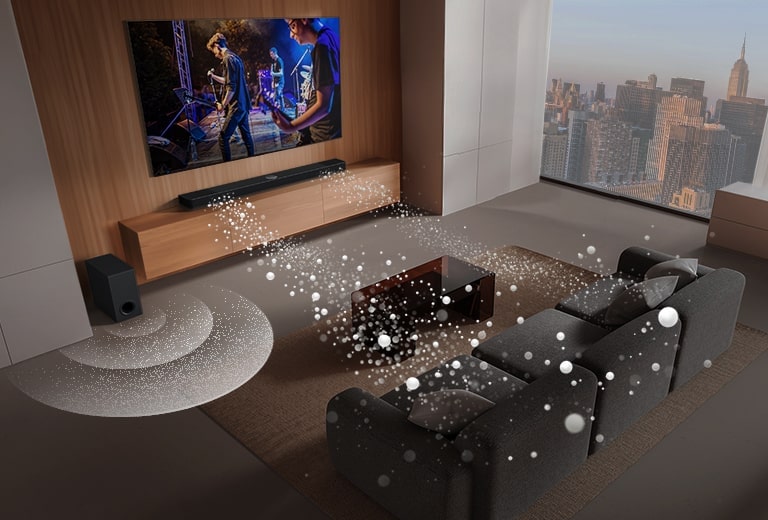 An image of an LG TV and LG Soundbar in a living room playing a musical performance. White soundwaves made up of droplets project from the soundbar, looping around the sofa and living space to depict surround sound. A city skyline is visible through the window. 