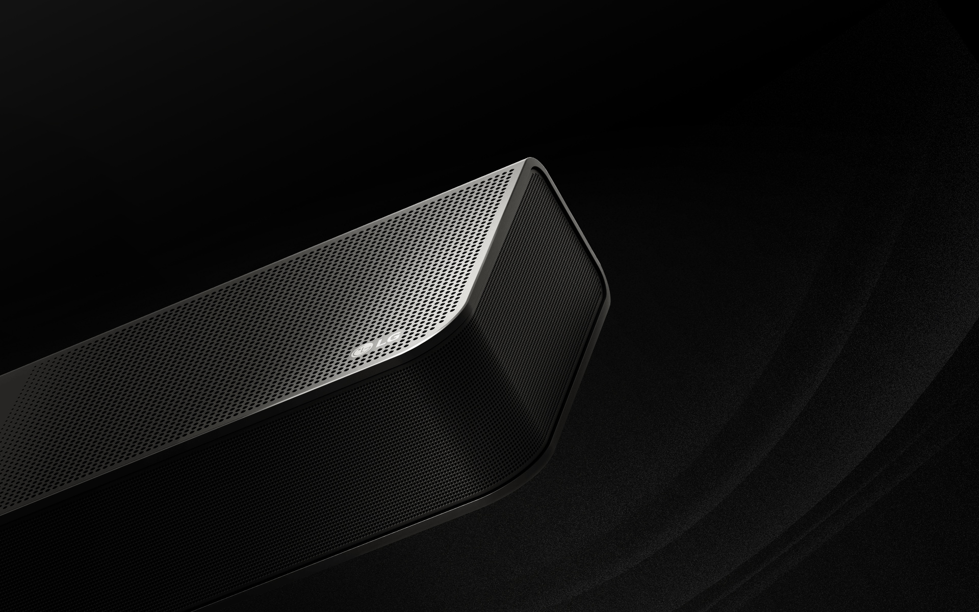 La barra de sonido LG tiene un fondo negro que revela su diseño comenzando desde la parte superior y moviéndose hacia la esquina. Gotas blancas se proyectan desde el centro y los extremos de la barra de sonido como una cascada, representando un sonido de disparo.