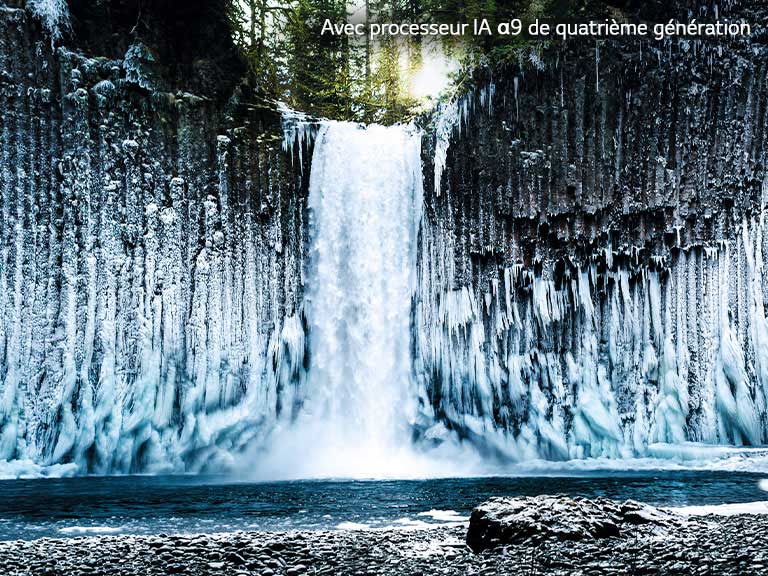 Slider comparison of picture quality of a frozen waterfall in a forest.