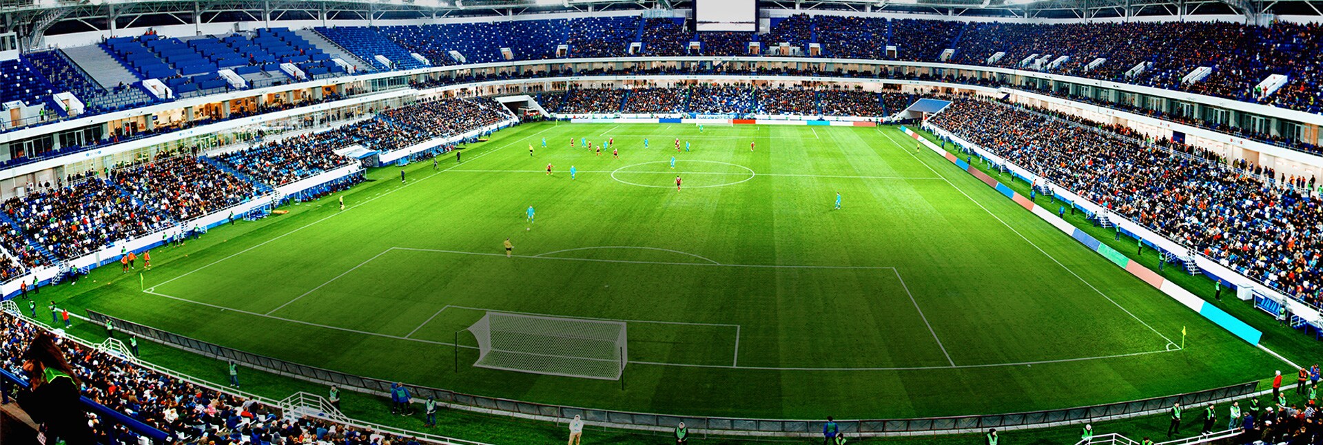 Vue aérienne d’un stade avec le bouton de lecture de la vidéo.