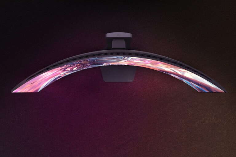An animated video transitioning from a front view to a top view of a curved monitor.