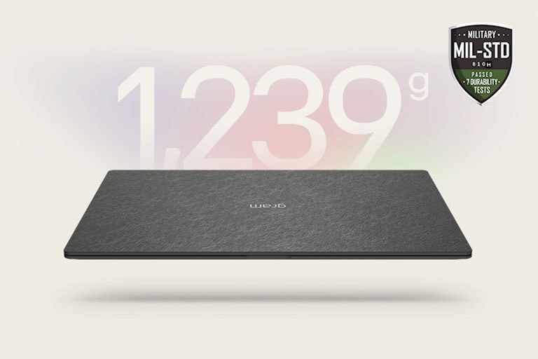 An animation showcasing a lightweight laptop with '1,239g' displayed in the first frame and '12.4mm' thickness in the second frame. Both frames include the MIL-STD durability badge, emphasizing portability and durability.