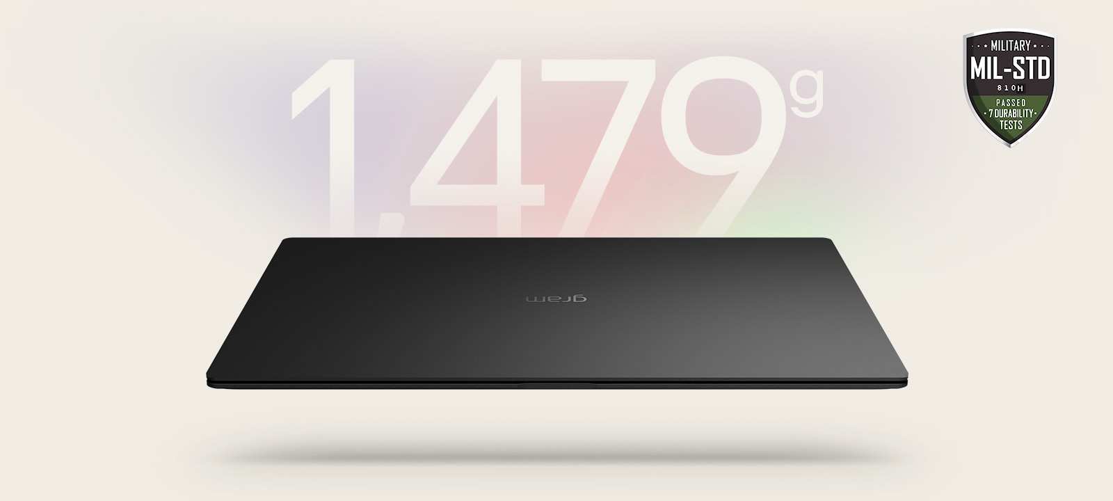 An animation showcasing a lightweight laptop with '1,479g' displayed in the first frame and '14.5mm' thickness in the second frame. Both frames include the MIL-STD durability badge, emphasizing portability and durability.