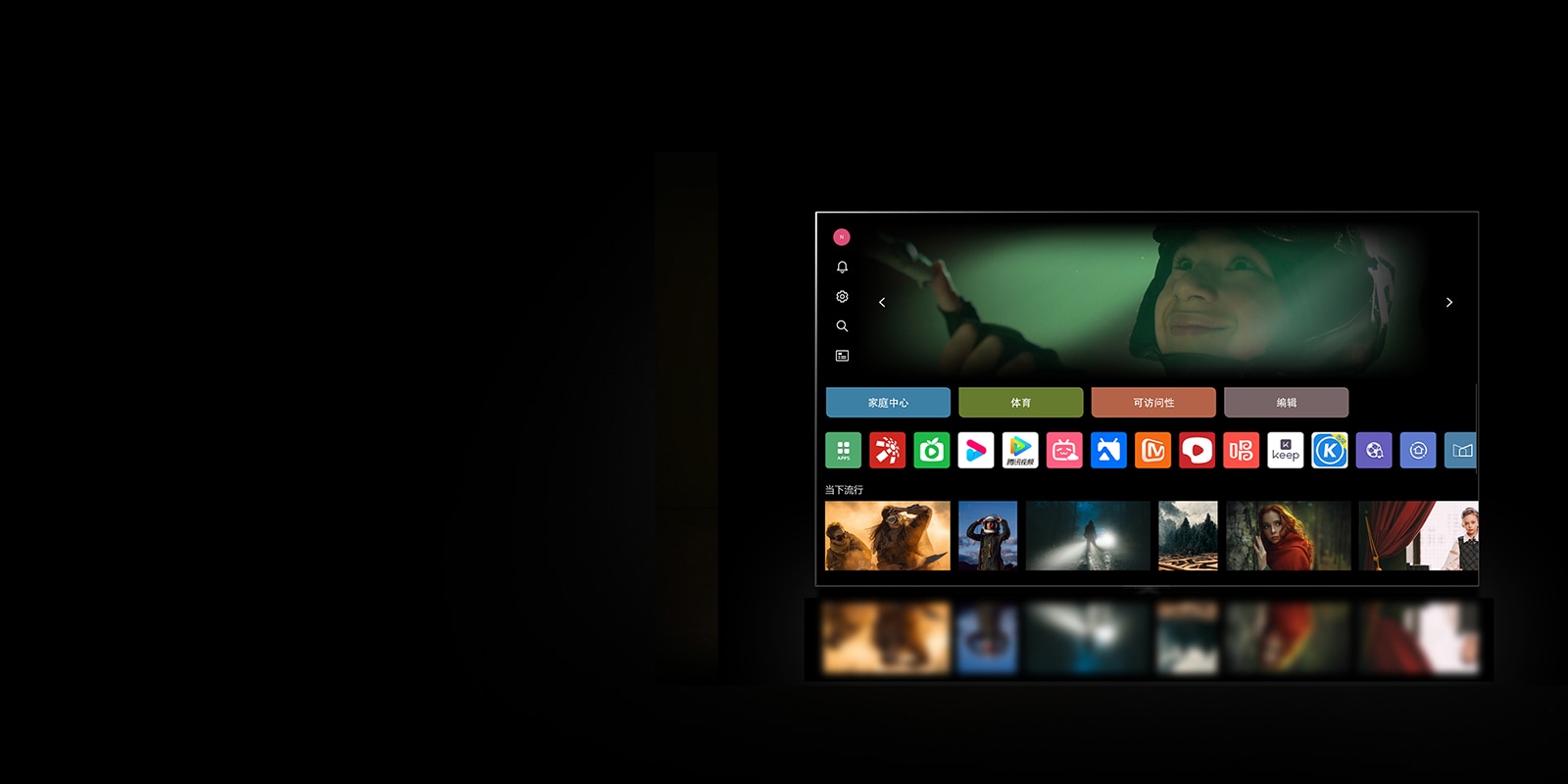 LG电视屏幕显示“我的账户”界面。上方第 3 个是 Tangible Wonders 横幅。横幅下面显示下列按钮：Home Hub、Sports、Game、Accessibility、Home Office。按钮下方显示下列徽标：LG Channels、Netflix、Prime Video、Disney+、Apple TV、YouTube、Spotify、Twitch、GeForce Now 和 Udemy。徽标下面，5 个电影缩略图显示在“Top picks for you（为您精选的热门内容）”字样下面。  一个鼠标点击左上角的首字母 'S'。 LG Account 弹出菜单打开，出现 5 个名称。鼠标点击第二个名称，屏幕上的缩略图和推荐内容发生变化。