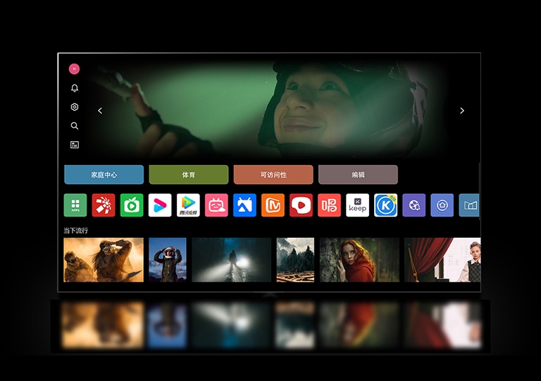 LG电视屏幕显示“我的账户”界面。上方第 3 个是 Tangible Wonders 横幅。横幅下面显示下列按钮：Home Hub、Sports、Game、Accessibility、Home Office。按钮下方显示下列徽标：LG Channels、Netflix、Prime Video、Disney+、Apple TV、YouTube、Spotify、Twitch、GeForce Now 和 Udemy。徽标下面，5 个电影缩略图显示在“Top picks for you（为您精选的热门内容）”字样下面。  一个鼠标点击左上角的首字母 'S'。 LG Account 弹出菜单打开，出现 5 个名称。鼠标点击第二个名称，屏幕上的缩略图和推荐内容发生变化。