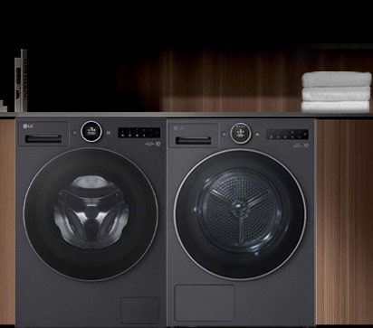 洗衣机和烘干机在室内并排放置的图像。