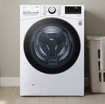 Lavadora de roupas LG 22 kg de carregamento frontal, modelo WM22WV26SR, com tecnologias AI DD™ e ThinQ™, em uma lavanderia moderna integrada ao estilo da cozinha.
