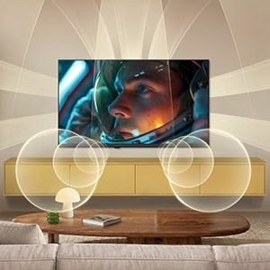 LG SMART TV AI LB65 with Virtual 9.1.2 by AI Sound fills a modern living space as an astronaut movie scene plays on screen, surrounding the room with multi-directional sound for a deeply immersive experience.