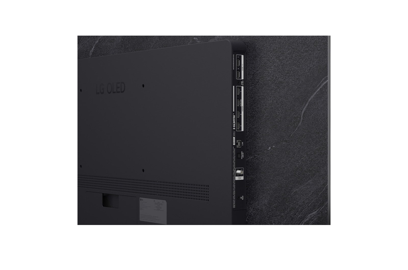 The front view of LG OLED evo AI C6, released in 2026, features a slim black bezel, with a vivid, sculpted swirl of layered rainbow tones flowing across the screen.