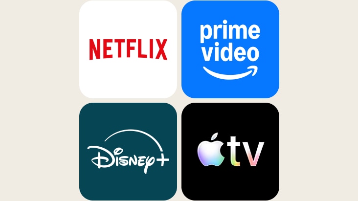 Le téléviseur LG AI présentant des services de diffusion en continu mondiaux affiche les logos de Netflix, Prime Video, Disney+ et Apple TV+ dans une disposition à quatre volets.