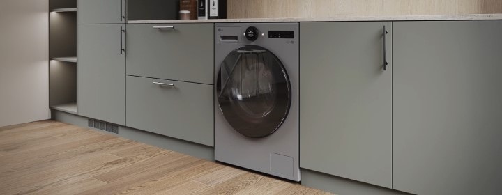 Lavadora LG perfectamente integrada en muebles modernos, incorporada en un elegante espacio de cocina