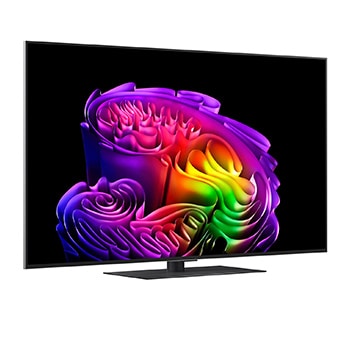 Der LG OLED evo AI G6 ist bündig an der Wand eines modernen Wohnzimmers angebracht. Er zeigt eine lebendige Aurora über einem ruhigen Küstendorf, die einem gerahmten Bild an der Wand ähnelt.