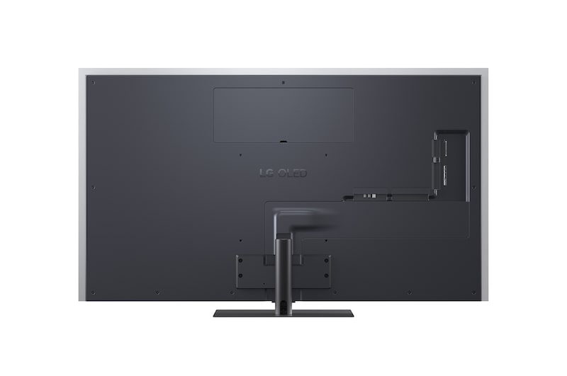 Der LG OLED evo AI G6, hier von der Seite abgebildet, besticht durch sein Gallery Design mit einer lückenlosen Wandmontage. Er zeigt eine Nachtszene mit einer beleuchteten Brücke und Spiegelungen im Wasser.