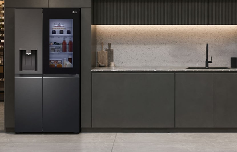 LG InstaView refrigerator with sleek black finish installed in modern minimalist kitchen interior.	