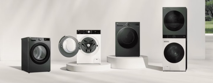 Lineup of LG washing machines including front load, dryer, and WashTower models displayed in a bright modern studio setting	