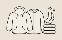 Illustration of hoodie, shirt, socks, and towels representing LG washing machine capacity ideal for medium sized families	