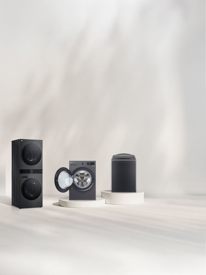 Lineup of LG WashTower™, Front-loading, Top-loading, and Washer-Dryers in a bright room with pedestals