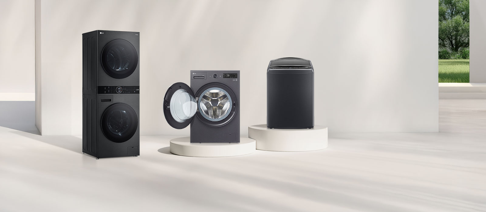 Lineup of LG WashTower™, Front Load, Top Load, and Twin Tub washing machines in a bright modern Saudi laundry space.