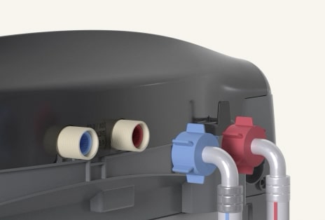 Rear view of a washer with hot and cold hoses connected securely.