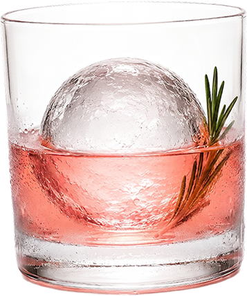 A glass of cocktail with a round ice sphere and a rosemary sprig on a red background.