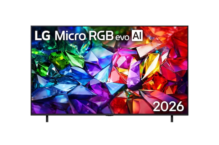 The front view of LG Micro RGB evo AI MRGB95, released in 2026, features a slim black bezel on low-profile feet, with a vivid, crystalline image of sharply defined red, green, and blue facets filling the screen. 