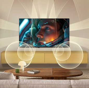 LG SMART TV AI LB65 with Virtual 9.1.2 by AI Sound fills a modern living space as an astronaut movie scene plays on screen, surrounding the room with multi-directional sound for a deeply immersive experience.