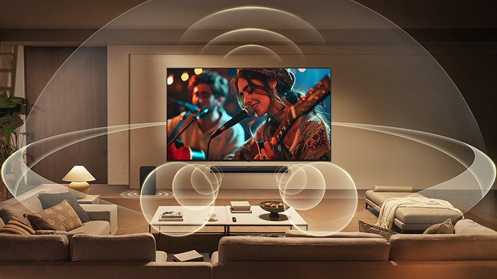 LG QNED evo AI QNED82 Mini LED with WOW Orchestra shows musicians performing on screen, as layered sound waves from the TV and soundbar below fill the living room to create a synchronized surround sound experience.