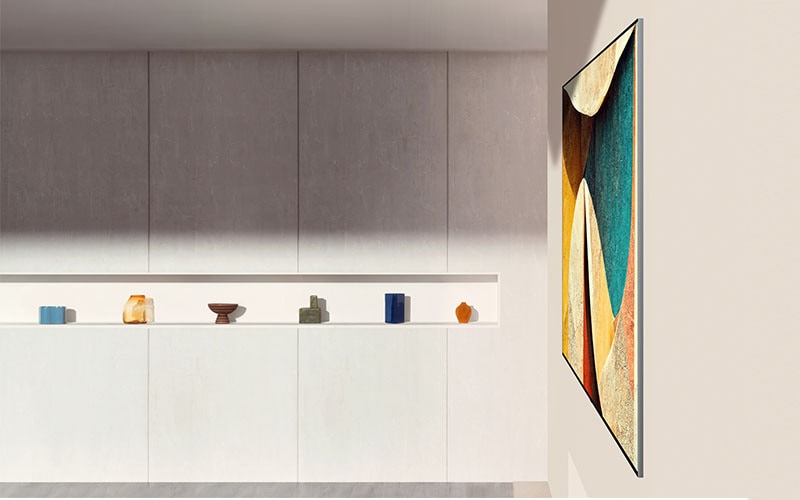 LG OLED evo AI G6 is placed in a modern living room as an Art TV, featuring a vibrant, colorful modern artwork and a slim profile that integrates smoothly into the sophisticated interior design of the space.