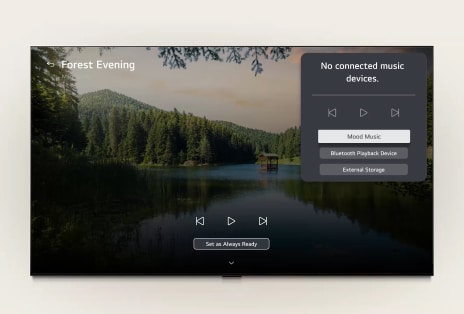 LG ART TV’s LG Gallery+ with BGM and Music Lounge shows the “Forest Evening” forest lake scene on screen, with a visible music lounge UI panel for mood music, Bluetooth playback, and controls.