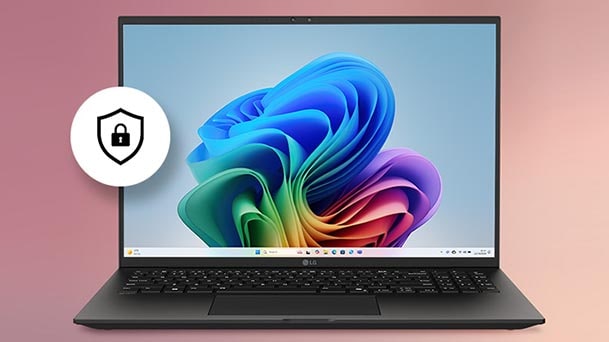 カラフルなWindowsの壁紙を映し出すノートパソコンの画像。その下にはセキュリティシールドアイコンがあり、デバイスに組み込みのハードウェアベース保護機能が備わっていることを示している。