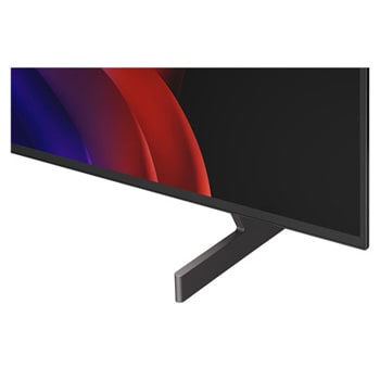 超薄型デザインと極細ベゼルを備えたLG OLED AI B6が、スタイリッシュなリビング空間に壁掛けで設置されている。画面には虹色のトーンで彩られた風景と、層をなす山々の造形が映し出されている。