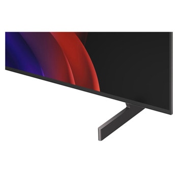 超薄型デザインと極細ベゼルを備えたLG OLED AI B6が、スタイリッシュなリビング空間に壁掛けで設置されている。画面には虹色のトーンで彩られた風景と、層をなす山々の造形が映し出されている。