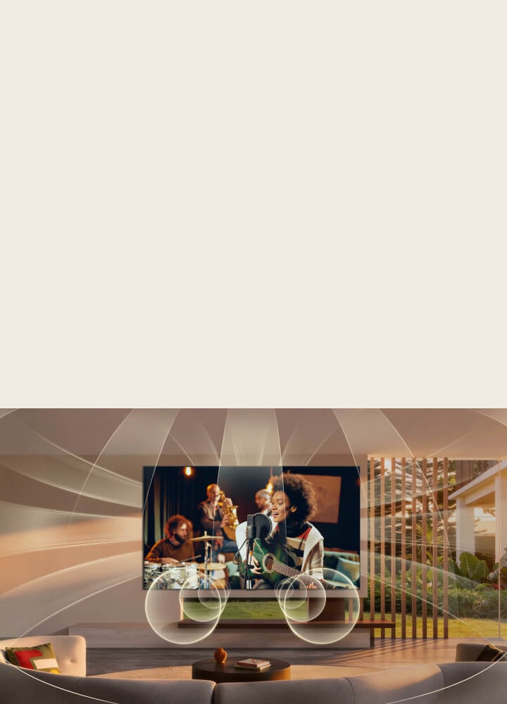 LG OLED evo AI C6 avec Virtual 11.1.2 Ch remplit un salon tandis qu’une performance musicale live joue à l’écran, offrant un son multidirectionnel qui entoure la pièce et augmente l’immersion dans tout l’espace.