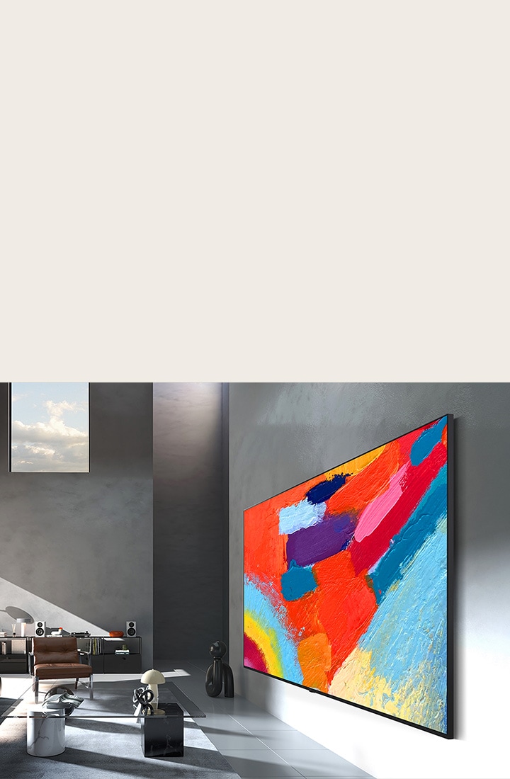 LG Micro RGB evo AI MRGB95, designed with Flush-fit Design, is seamlessly wall-mounted in a spacious room, displaying bold artwork in vivid colors that harmonize with the surrounding interior. 	