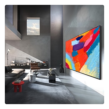 LG Mini RGB evo AI MRGB85 is wall-mounted in a spacious, contemporary living space, displaying a vivid abstract artwork with swirling, multicolored elements.