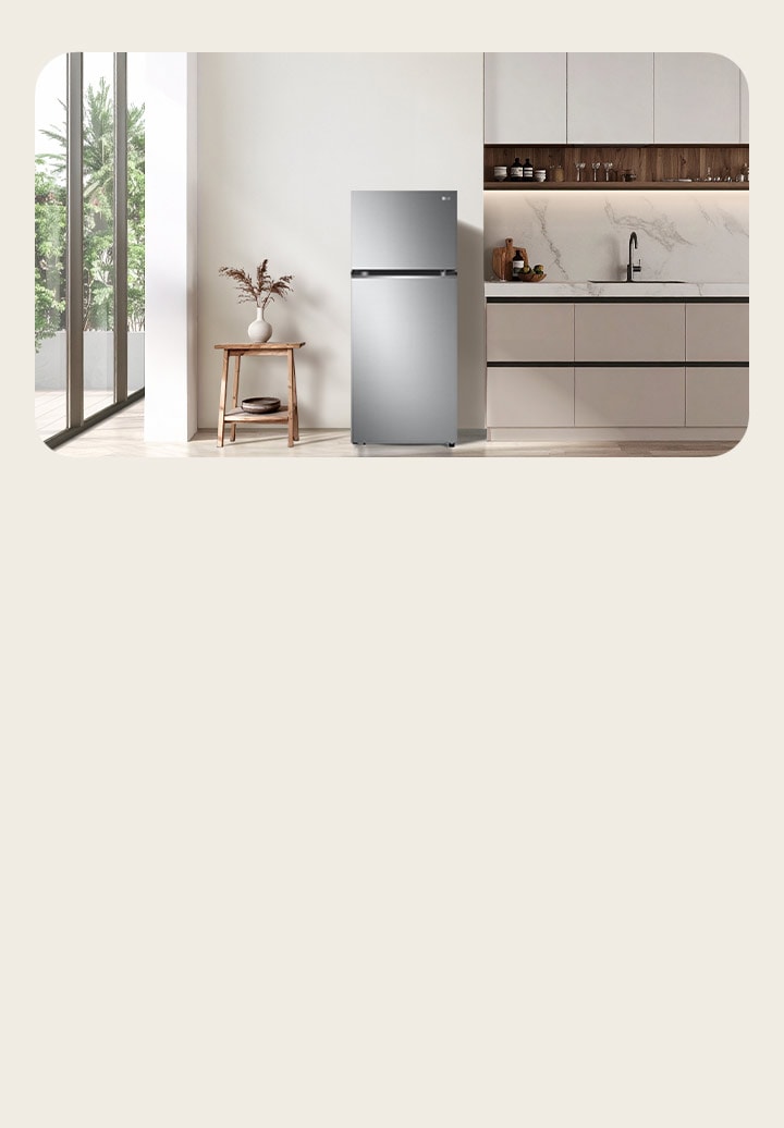Top Mount LG tall refrigerator freezer in white minimal white tone kitchen.	