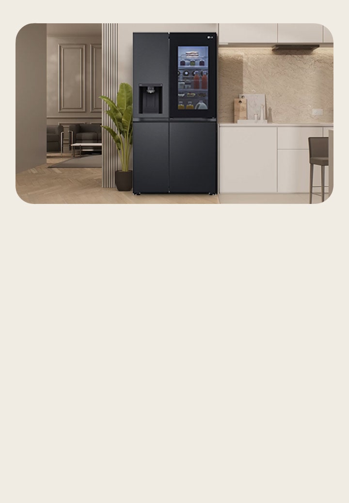 LG Silver side-by-side freezer with Instaview and water dispenser in the center. You can see a living room on the left and a modern kitchen on the right.	