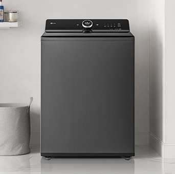 A top-loading washing machine is located in a multi-purpose room with a modern interior and a white floor	