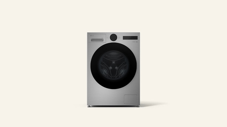 LG black Washer Dryer installed inside a grey-toned cabinet, with a faucet, potted plant, and basket placed above.