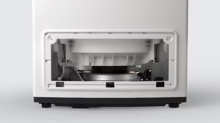 Rear access view of a commercial washer showing components designed for easy maintenance	